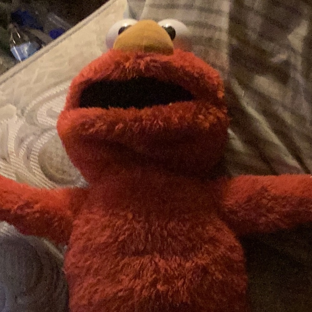Elmo from kid cartoon Sesame Street tm